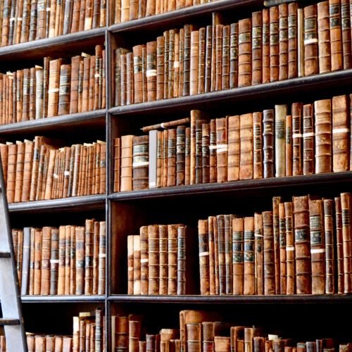 hundreds-of-old-books-in-the-library-of-trinity-college-in-dublin-ireland-with-a-ladder-to-reach-.jpg